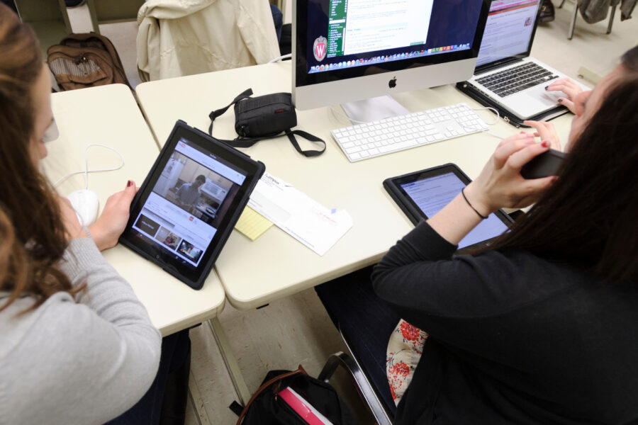 Journalism students working on iPads and computers