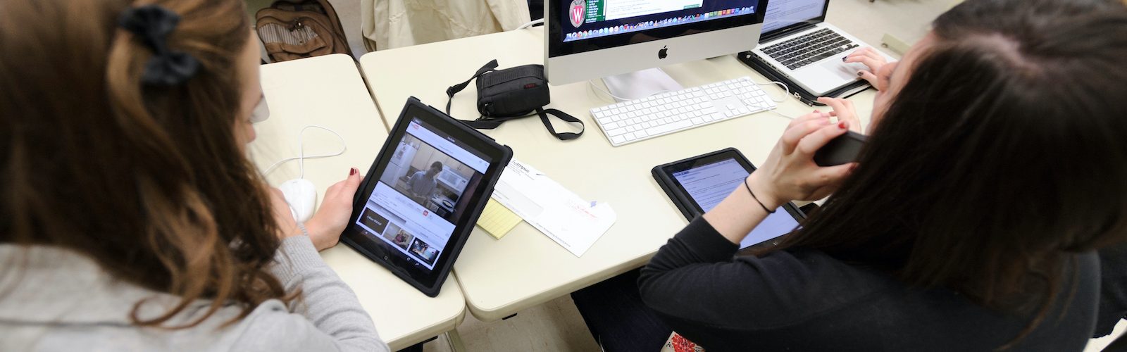 Students using iPads, laptops and desktop computers