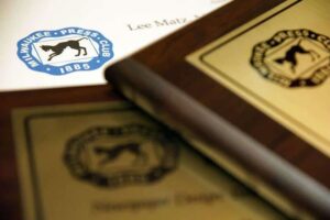 A close up shot of three Milwaukee Press Club awards