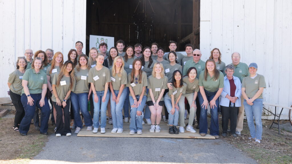 Students pose with staff of Madison Area Food Pantry Gardens