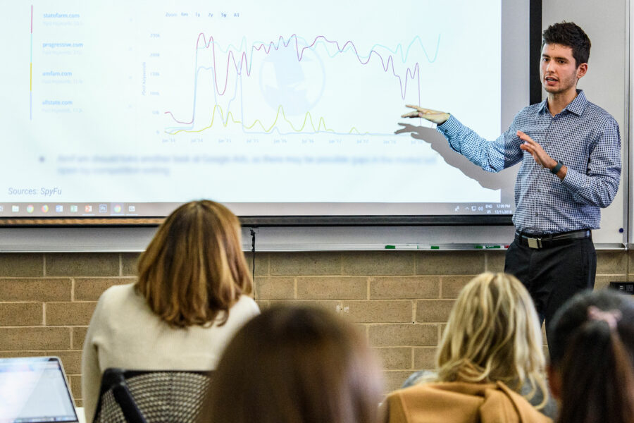 A student presents digital media data to a client