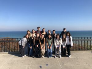 Professor Doug McLeod's class Creative Brand Strategies poses together on a client trip to Shorewood Village, Wisconsin