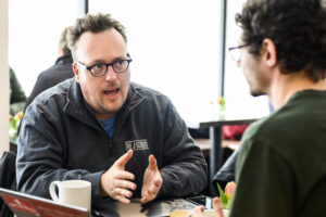 Professor Mike Wagner meets with a student