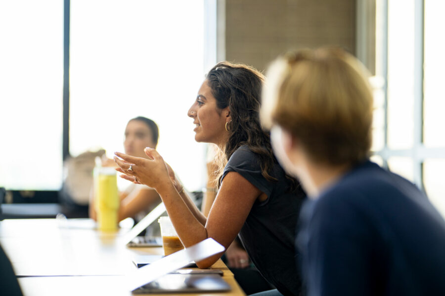 A student participates in a class lecture.