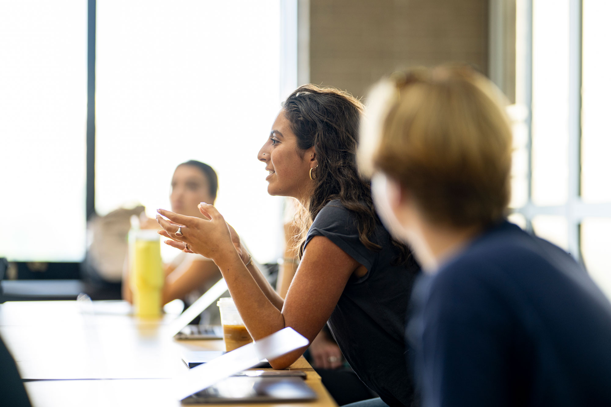 A student participates in a class lecture.
