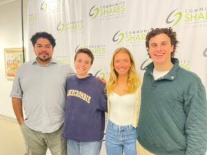 Students pose together at an event.