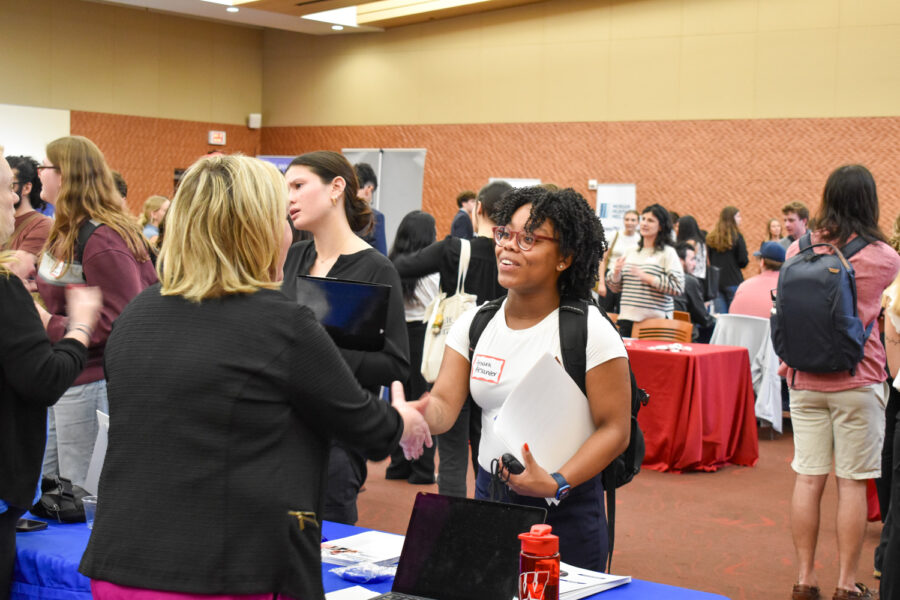 Amara Alexander (BA'25) meets an employer at the Communications Career Fair.