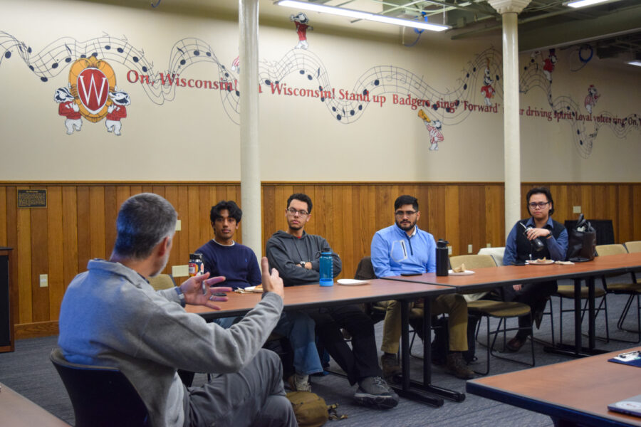 Adam Schrager teaches storytelling skills to 4 UW-Madison Posse scholars.