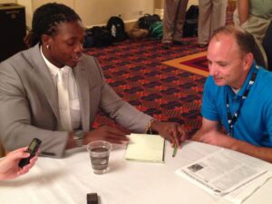 Tom Mulhern interviewing Melvin Gordon at Big Ten Media Day in July 2014