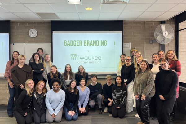 Students pose together after their media plan pitches to the Milwaukee Diaper Mission.