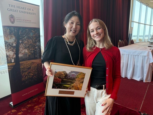Professor Young Mie Kim and SJMC student Kate Lewicki with Young Mie Kim's Phi Beta Kappa Teaching Excellence Award plaque.