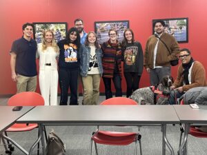 Students in professor Sue Robinson's directed study are spending the next year writing about housing insecurity. In this photo, the students pose together after an event with a community partner organization.