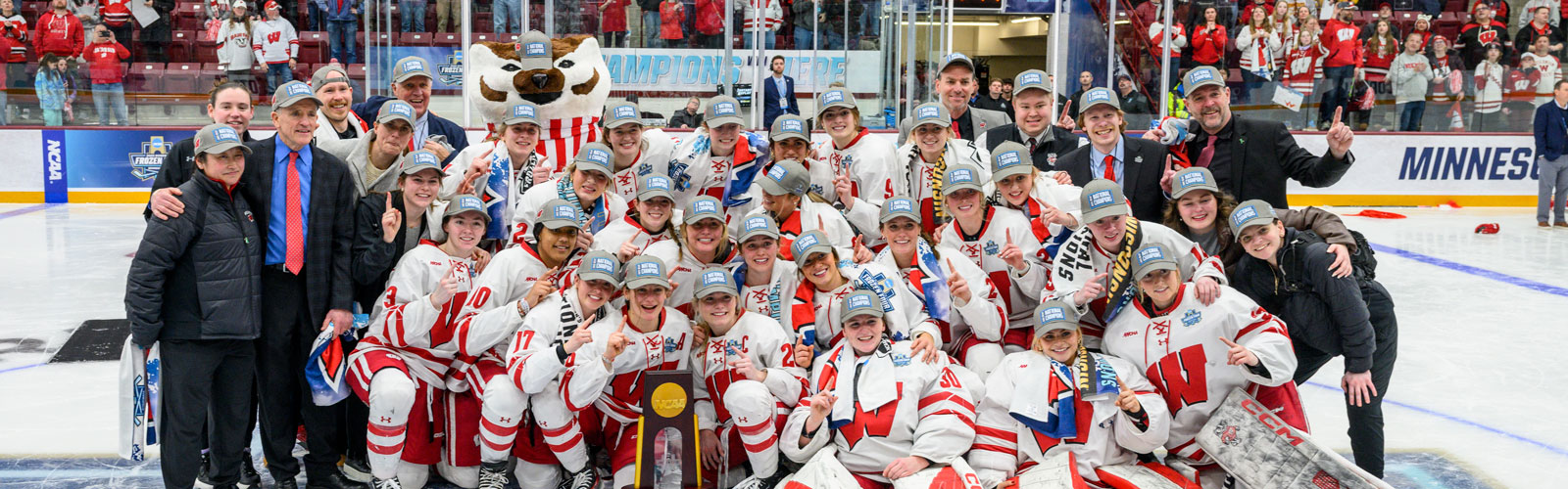 The Badger women's hockey team celebrates their NCAA championship win.