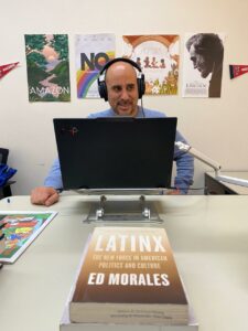 Elohim Monard records his podcast in his office