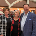Brenda Pogorzelski, SJMC Director Katy Culver and Steve Pogorzelski pose together at an event.
