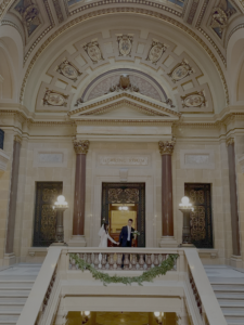 Mengyu Li and her husband in their wedding attire inside the Wisconsin State Capitol.