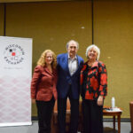 Chancellor Jennifer Mnookin, Andy Lack and Katy Culver pose together on stage.