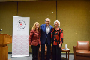 Chancellor Jennifer Mnookin, Andy Lack and Katy Culver pose together on stage.