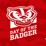Day of the Badger logo on a red background with sliver balloons and ribbons cascading down the side of the image
