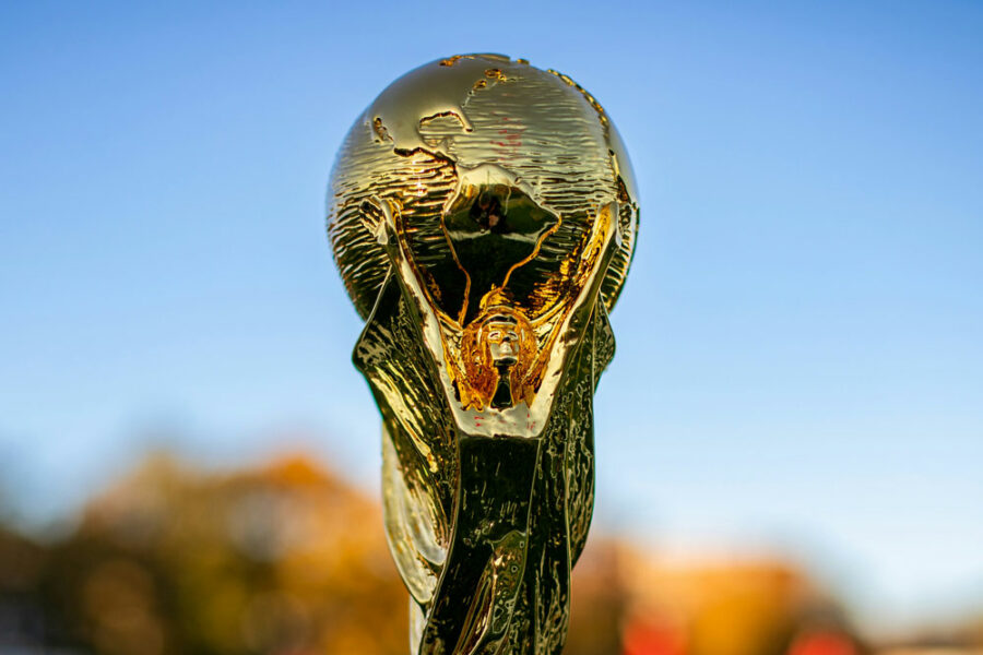 The top of the FIFA World Cup trophy with the blue sky in the background